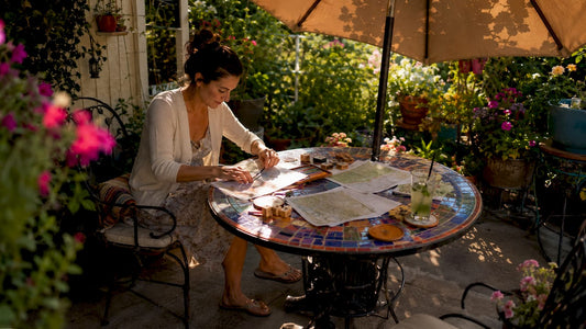 Woman personalizing map prints at home table