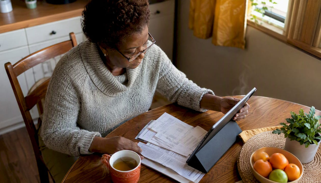 Woman reviewing credit card statements at home